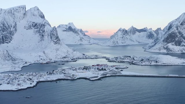 Beautiful drone video of scenic Lofoten Islands archipelago winter scenery with traditional fisherman Rorbuer cabins in the historic villages Reine, Hamnoy, Sakrisoy - Norway, Scandinavia