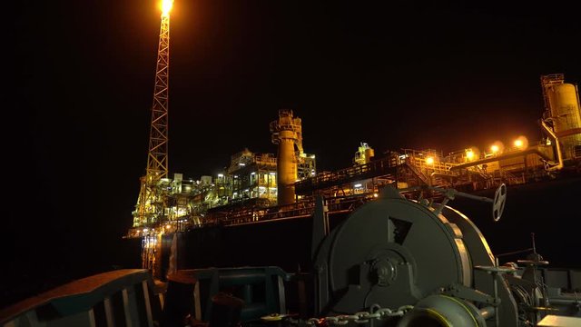 FPSO tanker vessel near Oil platform Rig. Offshore oil and gas industry, sea oil production and storage.