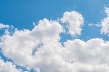Blue sky with white clouds. Sky background.