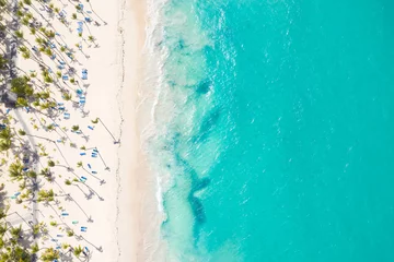 Fotobehang Aerial view from drone on caribbean seashore with coconut palm trees and sunbeds. Summer holidays © photopixel