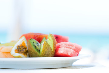 Fresh tropical fruits on sea background