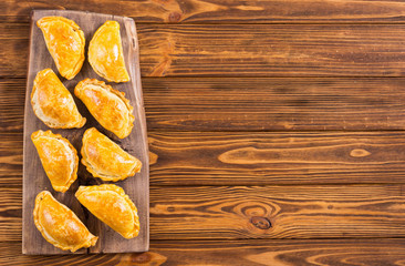 Latin American baked beef empanadas with sauce