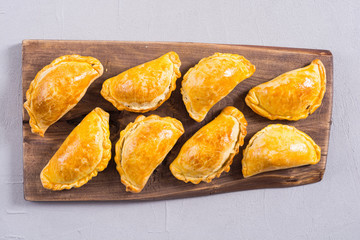 Latin American baked beef empanadas with sauce