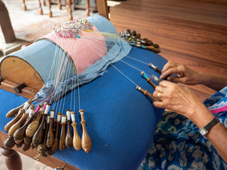 Old Indian woman making bobbin lace.  Detail of woman's hands.  Sri Lanka, March 18, 2019.