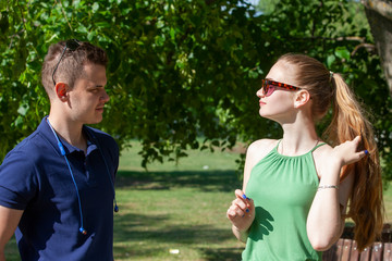 Obraz premium Happy young couple hugging and laughing outdoors.