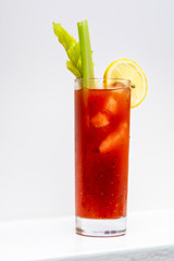 freshly made Bloody Mary cocktail or tomato juice, garnished with celery and lemon