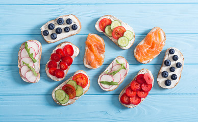 Variation of toast with fruit , vegetable and salmon
