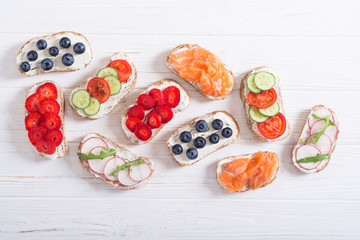 Variation of toast with fruit , vegetable and salmon
