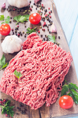 Raw minced beef meat with spices and herbs