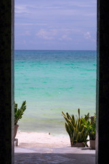 The view of the beach framed with alley