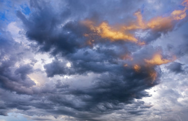 CLOSE UP: Dark grey stormy clouds gather above Lake Maggiore on a summer evening