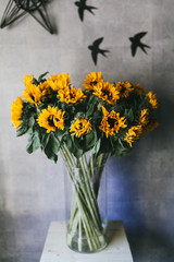 Bouquet of yellow small sunflowers close up