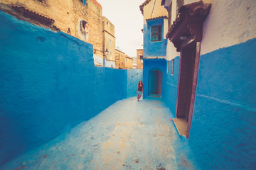 tourist traveling in chefchaouen, Morocco. chefchaouen is famous as to be the blue city of Africa