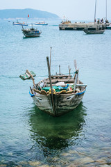Naklejka na ściany i meble Traditional Vietnamese fishing boat at anchor, Cham island, Vietnam