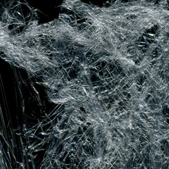 Transparent plastic wrap on the black background. Plastic bag texture. Reusable trash and waste.