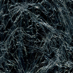 Transparent plastic wrap on the black background. Plastic bag texture. Reusable trash and waste.