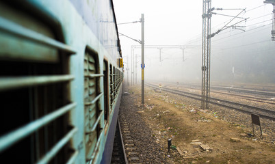 View through the window train in the polluted city of New Delhi, India. Indian Railways, often described as the Òtransport lifeline of the nationÓ, is the fourth largest railway network in the world.