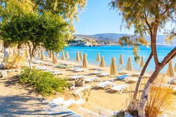 Umbrellas and chairs on beautiful Amopi beach, Karpathos island, Greece