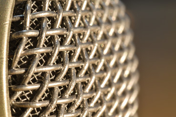 Close up shot of retro microphone mesh at angle
