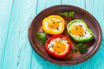 Yellow , red and green pepper with fried eggs