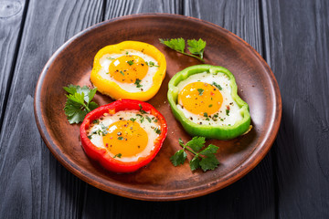 Yellow , red and green pepper with fried eggs