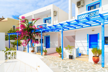 Fototapeta na wymiar Typical whitewashed houses with blue doors and flowers in Ammopi village, Karpathos island, Greece