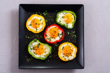 Yellow , red and green pepper with fried eggs