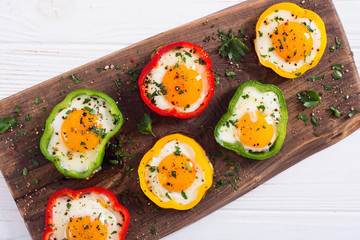 Yellow , red and green pepper with fried eggs