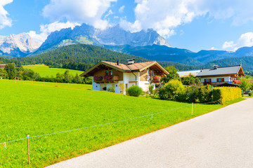Obraz premium Traditional alpine houses in village of Going am Wilden Kaiser on beautiful sunny summer day, Tirol, Austria