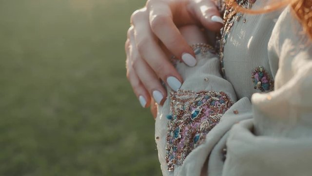 Indian Wedding Preparation. Luxury Fashion beauty Accessories: Female hand close up Eastern Traditional Sari clothes.