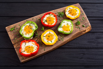 Yellow , red and green pepper with fried eggs