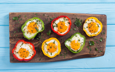 Yellow , red and green pepper with fried eggs