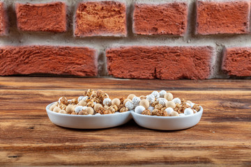 Roasted chickpeas in white cup on hardwood.The Turkish name is leblebi.