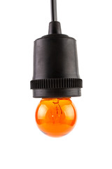 Orange Incandescent round light bulb hanging on ceramic Lamp Holders covered with black rubber isolated on white background.