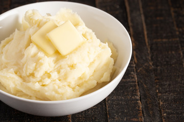Mashed Potatoes with Butter on a Wooden Table