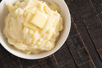 Mashed Potatoes with Butter on a Wooden Table