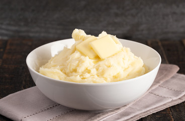 Mashed Potatoes with Butter on a Wooden Table