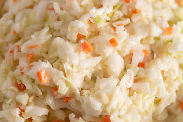 Bowl of Coleslaw on a Rustic Wooden Table