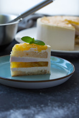 Mango fruit Mousse Cake, decorated with fresh fruits in jelly. Whipped cheese with biscuits