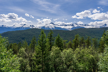mountains with white clouds and blue sky landscape panorama.