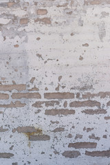 Worn Stucco and Brick Wall Vertical