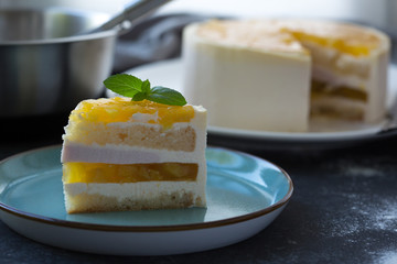 Mango fruit Mousse Cake, decorated with fresh fruits in jelly. Whipped cheese with biscuits