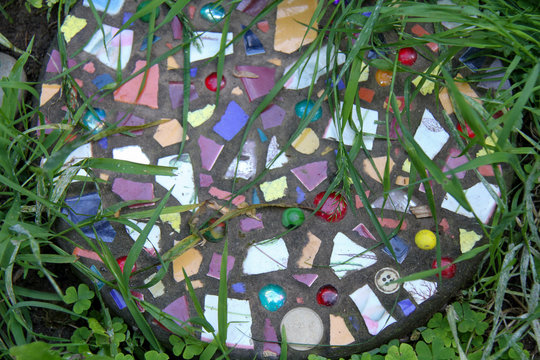 mosaic colorful stepping stone with grass 