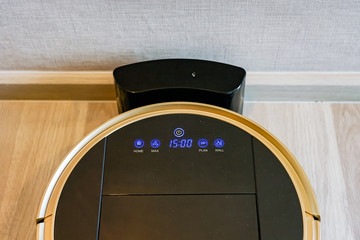 robotic vacuum cleaner on laminate wood floor, smart cleaning technology