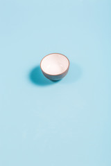 Fototapeta na wymiar Crossing traditional small teacups on a blue background