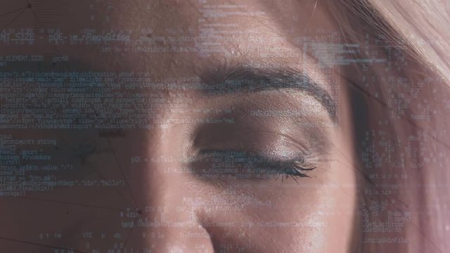 Digital composite of a woman eye looking at the coding system