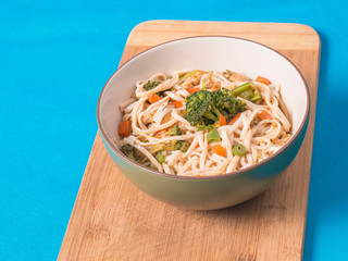 Chicken Chow Mein Bowl with Broccoli Carrots and Onions with Soy Sauce