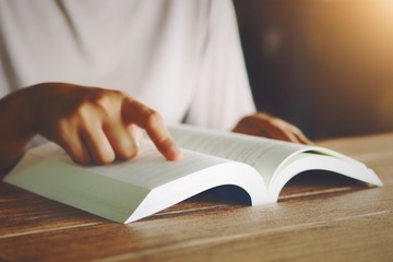 Concept of education Reading books, finding information, may give us an answer to the problem. And found the light of the exit.