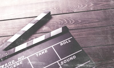 Movie clapper board on wooden background