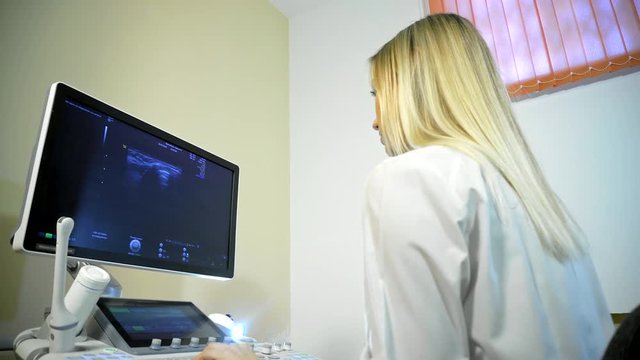 Doctor Taking A Sonogram on ultrasound machine